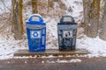 Trash cans with snowy slope and trees background Royalty Free Stock Photo
