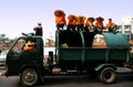 Trash collectors waiting at the Flower Carnival