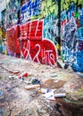 Trash and colorful designs in Graffiti Alley, Baltimore, Maryland. Royalty Free Stock Photo