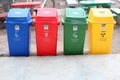 Trash different colors, red, green, blue, yellow for waste sorting, waste recycling