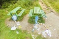 Trash and garbage near bench in mountain