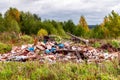 Trash landfill garbage pile in the agriculture field. Ecology pollution environment contamination problem concept Royalty Free Stock Photo