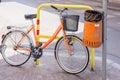 Trash metal orange waste and bicycle