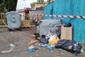 Trash in overloaded garbage bins in courtyard of residential district. Ecological problem of environmental pollution