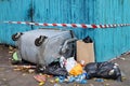 Trash in overloaded inverted garbage bins on city street. Ecological problem of environmental pollution