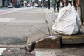 Trash packed in white plastic trash bag on the city street of New York waiting for pick-up. Royalty Free Stock Photo