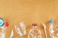 Plastic trash on a sandy beach with Trash from plastic bottles on a sandy beach with free space Royalty Free Stock Photo