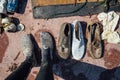 Trash and pollution, clothing footwear shoes waste collected from the sea by cleaning volunteers