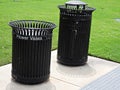 Trash receptacles installed on a cemetery to discard flower vases and trash Royalty Free Stock Photo