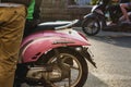 Trashy hipster pink scooter reflecting sunlight on a sunny day Royalty Free Stock Photo