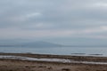 Trasimeno lake shore at dawn with low light and muted colors Royalty Free Stock Photo