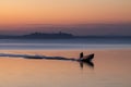 Trasimeno lake at sunset with a man on a little boat Royalty Free Stock Photo