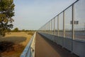 Transparent anti noise fence on highway bridge Royalty Free Stock Photo