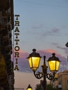 Trattoria signboard in at nightfall. Royalty Free Stock Photo