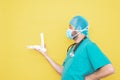 Trauma surgeon wearing an operating theatre uniform and stethoscope, checking a skeleton model of a foot, right lower limb, all on