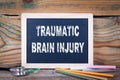 Traumatic brain injury. Chalkboard on a wooden background