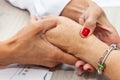 Traumatologist female doctor at her office examining a senior female patient. Skeleton bone disease exam and medic aid. Career Royalty Free Stock Photo