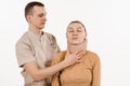 Traumatologist puts soft collar or bandage on girl to stabilize cervical region in case of neck pain, injuries and
