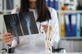 Traumatologist in uniform examine patient scan, prepare conclusion Royalty Free Stock Photo