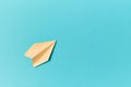 Travel abroad. Bon voyage. Flying dream. Vacation concept. Paper airplane on blue background. Copy space. Mockup style Royalty Free Stock Photo