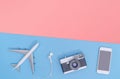 Travel accessories objects gadgets top view flatlay on blue pink yellow copy space Royalty Free Stock Photo