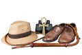 Travel and adventure concept. Vintage brown shoes with fedora hat, bullwhip, binoculars and key of life ankh isolated Royalty Free Stock Photo