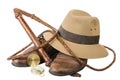 Travel and adventure concept. Vintage brown shoes with fedora hat, bullwhip and compass isolated Royalty Free Stock Photo