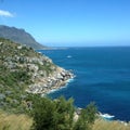 Travel Africa, South African coastline with rocky outcrop next to blue ocean