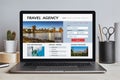 Travel agency concept on laptop screen on modern desk Royalty Free Stock Photo