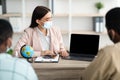 Travel Agent Lady Showing Laptop Screen To Couple In Office Royalty Free Stock Photo