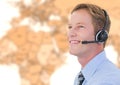 Travel agent man wearing headset in front of world map Royalty Free Stock Photo