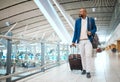 Travel, airport and luggage with a business black man walking in a terminal for global success. Manager, mockup and Royalty Free Stock Photo