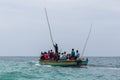 Travel around Africa. Boat full of African people floating on the waves.