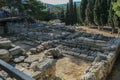 Travel around Europe by car. An ancient ruins of Greek Knossos palace and group of tourists. Royalty Free Stock Photo