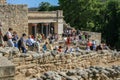 Travel around Europe by car. An ancient ruins of Greek Knossos palace and group of tourists. Royalty Free Stock Photo