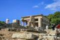 Travel around Europe by car. An ancient ruins of Greek Knossos palace and group of tourists. Royalty Free Stock Photo