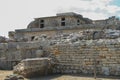 Travel around Europe by car. An ancient ruins of Greek Knossos palace and group of tourists. Royalty Free Stock Photo