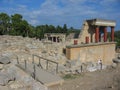 Travel around Europe by car. An ancient ruins of Greek Knossos palace and group of tourists. Royalty Free Stock Photo