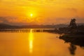 Travel asia. Waterfront lifestyle of the Mon community. Golden morning light. Mon Bridge is the long wooden bridge. Mon village, Royalty Free Stock Photo