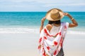 Travel asia woman with hat and dress on sea Royalty Free Stock Photo