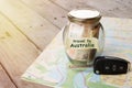 Travel Australia by car - money jar and roadmap Royalty Free Stock Photo