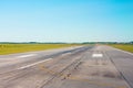 Travel aviation concept. Runway, airstrip in the airport terminal with marking on blue sky background.