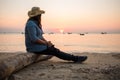 Travel background beautiful young women sit alone beach with sea