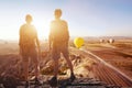 Travel background, couple of travelers looking at the panoramic spectacular beautiful view of mountains