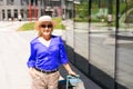 travel background, woman tourist walking with suitcase on the street in european city, tourism in Europe Royalty Free Stock Photo