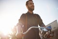 Travel, bicycle and happy man in road with lens flare for exercise, commute and cycling in morning. Transport, city and