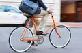 Travel, bicycle and legs of business man in a road riding to work or appointment in a street. Carbon footprint, cycling