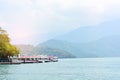 Travel boats parking at  the pier with sunset and mountain scenery background, sun moon lake, Taiwan Royalty Free Stock Photo