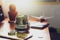 Travel budget concept. Money for travel savings in a glass jar o Royalty Free Stock Photo