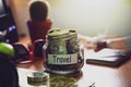 Travel budget concept. Money for travel savings in a glass jar o Royalty Free Stock Photo